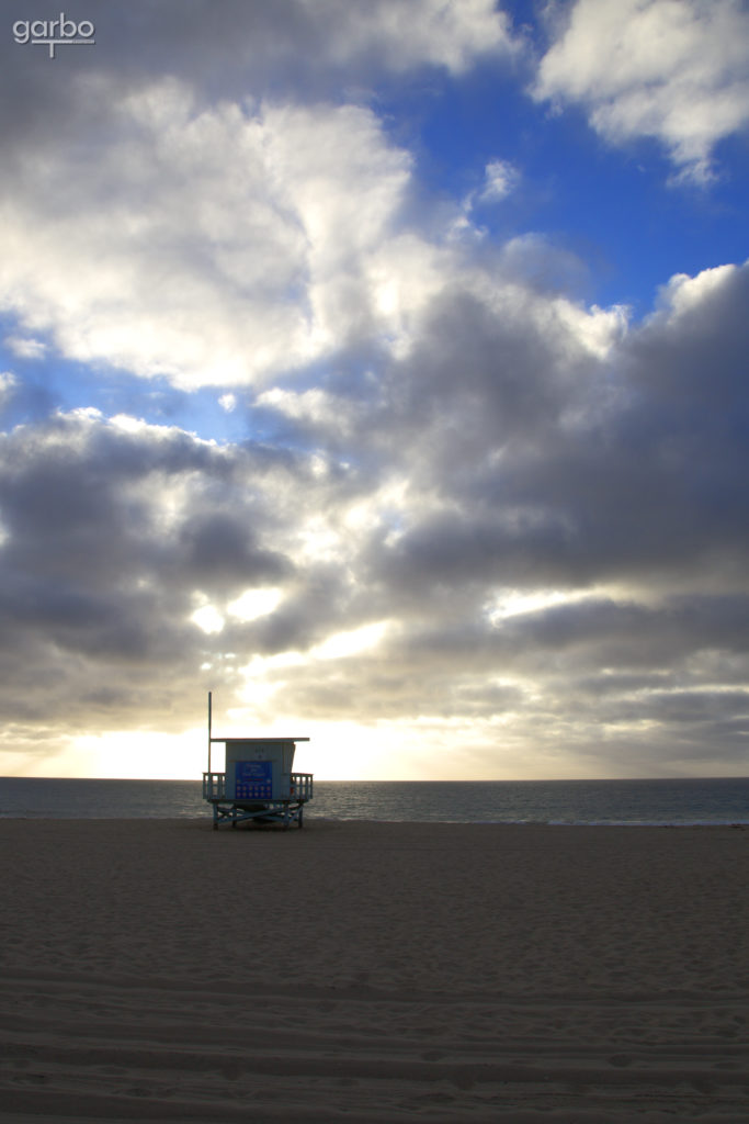 lifeguard tower in setting sun