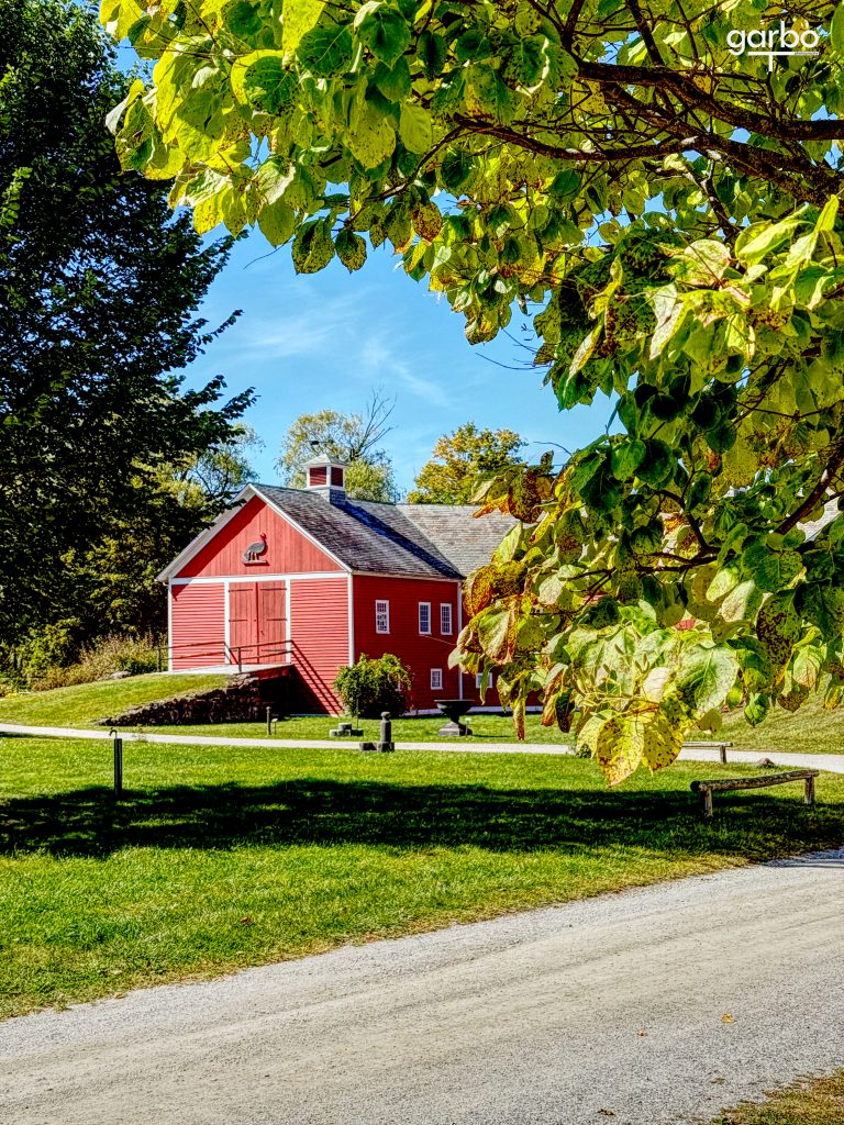Red barn with green foliage