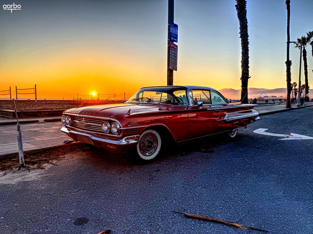 Classic red car in the sunset